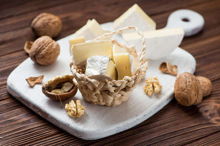 walnut with brie cheese on wooden table. milk product backgroundの写真素材