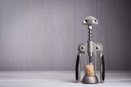 close up of metal modern wine corkscrew on wood backgroundの写真素材