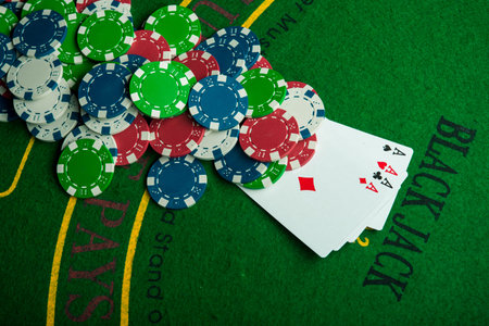 four ace in poker game. casino chips. chance to win the game