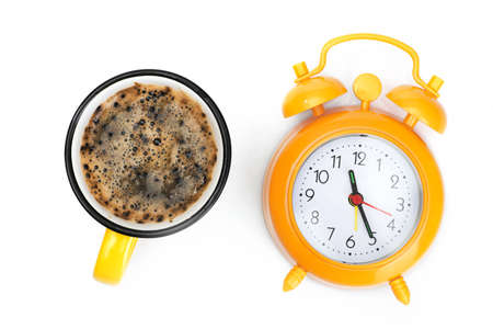 time for a coffee break, orange cup and alarm clock isolated on white background. top viewの写真素材