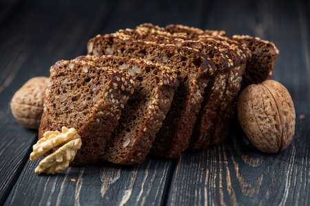 rye bread with sesame and nut on wooden tableの写真素材