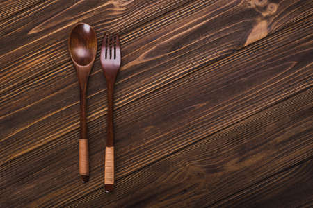 knife and fork on wooden table.cutlery on backgroundの写真素材