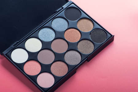 cosmetic make-up palette on pink backgroundの写真素材