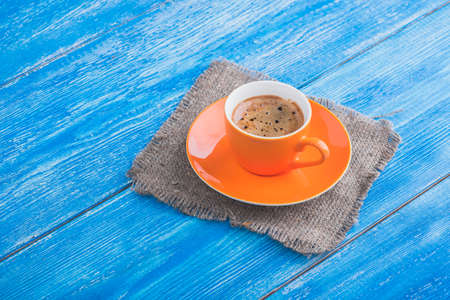 morning coffee cup on wood blue old table. tasty breakfastの写真素材