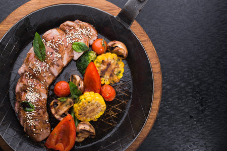 Grilled Vegetables and beef steak on frying pan .nutritious food right from the grill. hot...