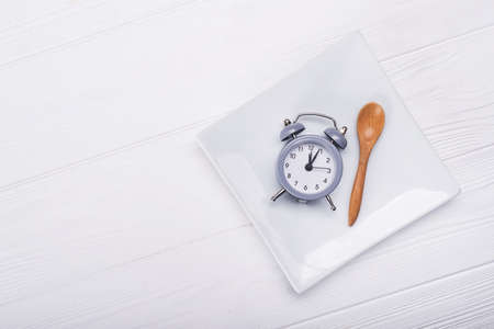 top view of plate with clock. diet concept backgroundの写真素材