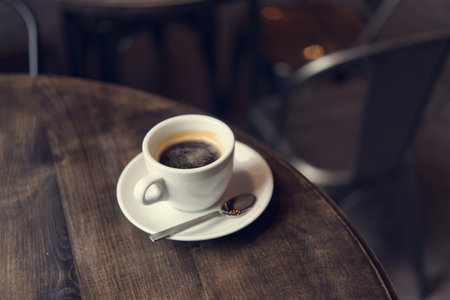 cup of coffee on table in cafe shop. fresh drink since morning background
