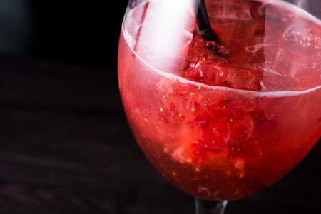 strawberry summer cocktail drink on a dark backgroundの写真素材
