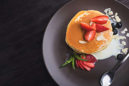 tasty pancake with strawberries on a tableの写真素材