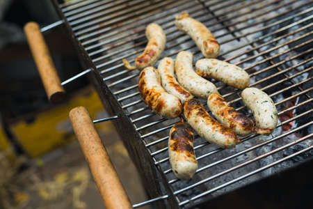 fresh sausage barbecue on the grill, street food festivalの写真素材