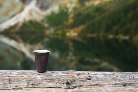 A cup of morning coffee in the mountains, hot drink in cold weather backgroundの写真素材