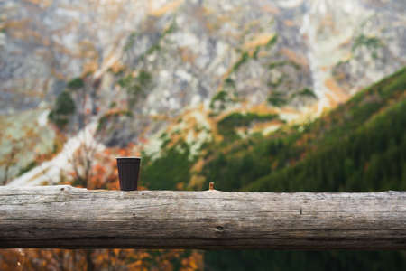 A cup of morning coffee in the mountains, hot drink in cold weather backgroundの写真素材