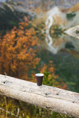 A cup of morning coffee in the mountains, hot drink in cold weather backgroundの写真素材