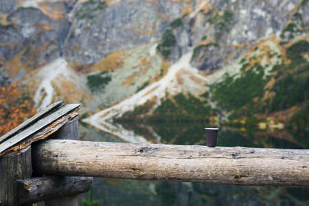 A cup of morning coffee in the mountains, hot drink in cold weather backgroundの写真素材