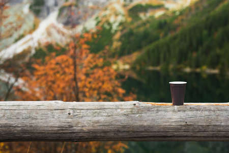 A cup of morning coffee in the mountains, hot drink in cold weather backgroundの写真素材