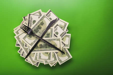 pile of dollars, view of top on green background, currency conceptの写真素材