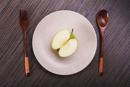green apple fruit on a plate. top view. vegetarian breakfastの写真素材