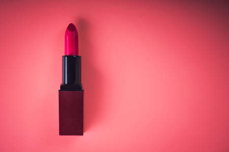 makeup cosmetic red lipstick on pink backgroundの写真素材