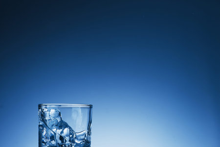 Glass of water on a light backgroundの写真素材