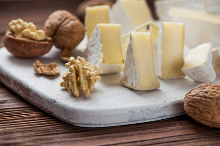 walnut with brie cheese on wooden table. milk product backgroundの写真素材