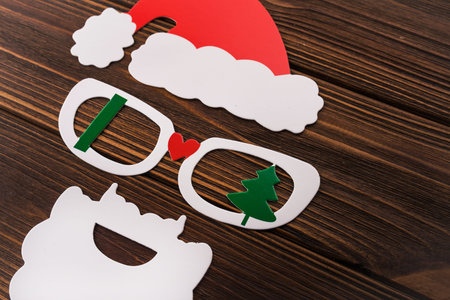 mask of santa claus with photo booth on white background. New Year's concert from the cap, glasses and beardの写真素材
