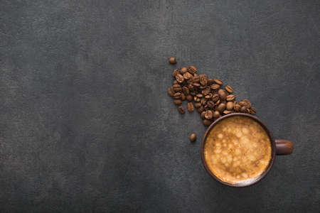 aroma cup of coffee on a dark stone table. top view with copyspaceの写真素材