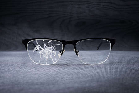 broken glasses on a metal background. concept of failure in businessの写真素材