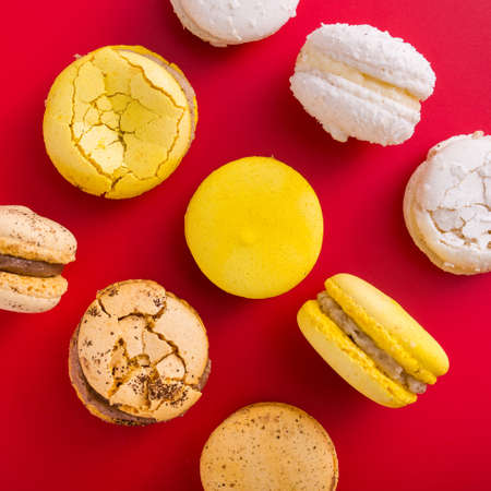 delicious french macaroon cake on a red backgroundの写真素材