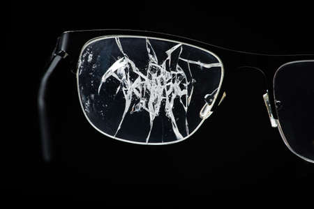 close up of crack texture on glasses at black backgroundの写真素材