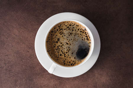 White aroma coffee cup, vintage concrete table background, top view, espresso drinkの写真素材