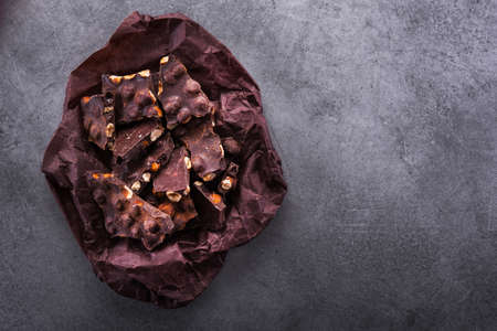 Dark chocolate bar on a stone table, top viewの写真素材