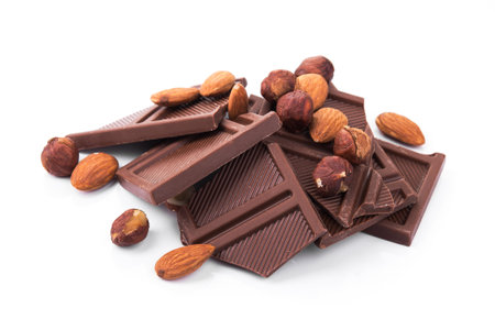 Dessert chocolate piece with nuts isolated on a white background