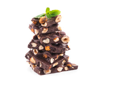 Dessert chocolate piece with nuts isolated on a white backgroundの写真素材