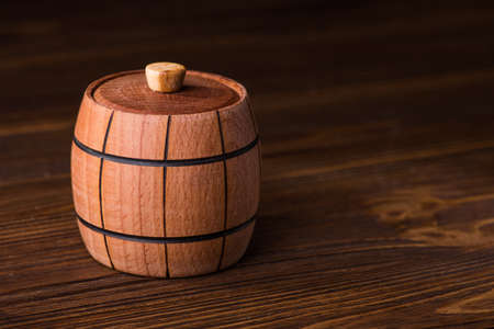 Closed small wood barrel on a tableの写真素材
