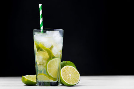 Caipirinha of Brazil cocktail with fruit lime on a table. invigorating and cold drink with ice