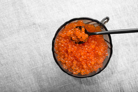 Red caviar in a bowl on table. Seafood backgroundの写真素材