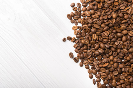 Closeup of coffee roasted beans on a backgroundの写真素材