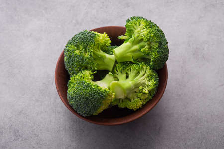 Fresh raw green broccoli on a table. Diet healthy product.の写真素材