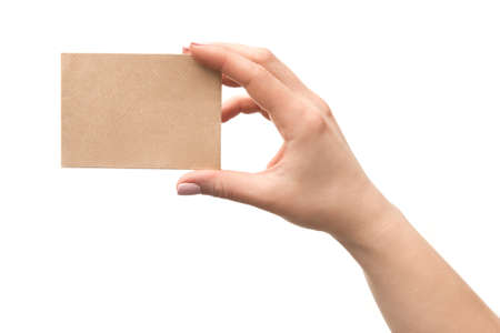 Woman hand holding old paper card isolated on a white backgroundの写真素材