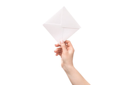 A female hands holding mail envelope isolated on a white background