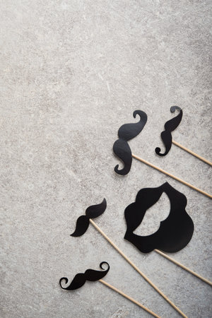 Black photo booth man mustache on a stone background. Retro style element of hipster party. top viewの写真素材
