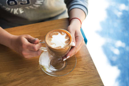 young woman drinking coffee in a cafe. good morning conceptの写真素材