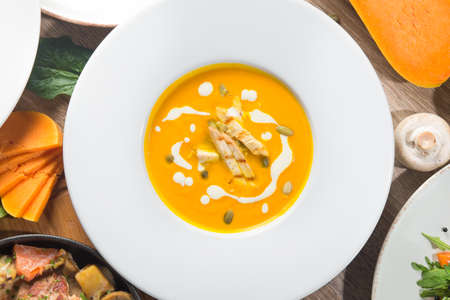 Pumpkin soup with chicken. autumn food. top viewの写真素材