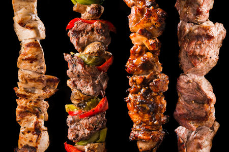 BBQ grill meat isolated on a black background. shashlik barbeque foodの写真素材