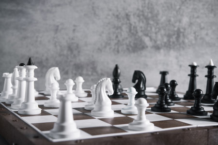chess board game on a stone background. chessboard battle
