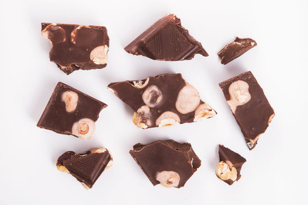 chocolate bars with nuts isolated on a white backgroundの写真素材