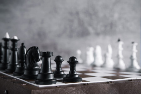 chess board game on a stone background. chessboard battle