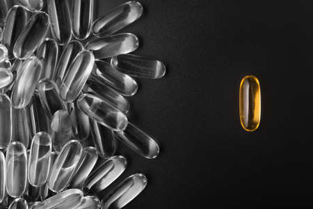 One golden pill not like everyone.の写真素材