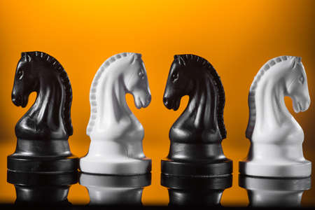 Emphasis on the knight chess piece, yellowの写真素材