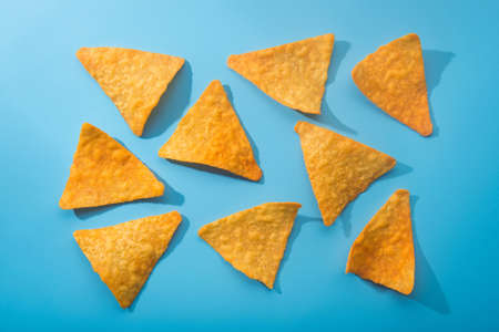Golden corn chips on a blueの写真素材